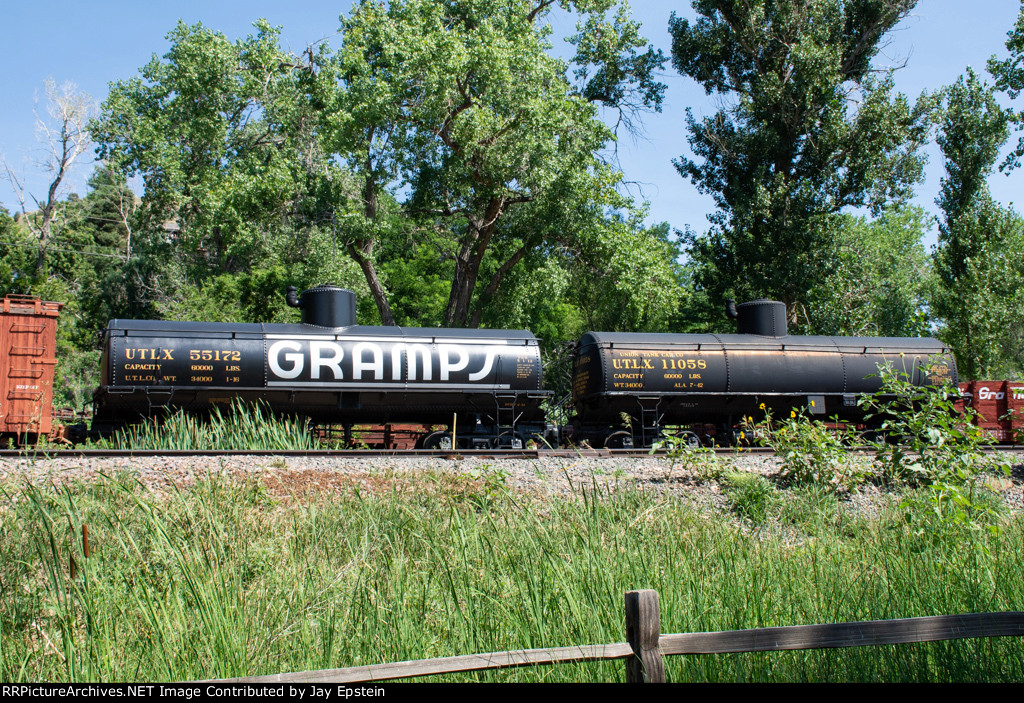 Two Narrow Gauge Tank cars sit on display at the Colorado Railroad Museum